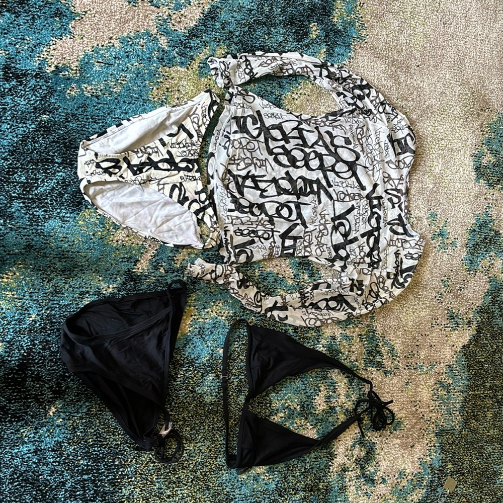 Victoria’s Secret black-and-white bottom and cover up with DKNY black bikini